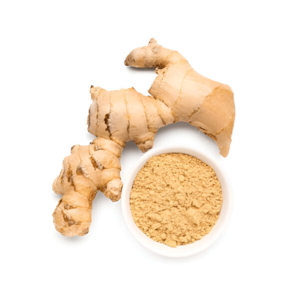 Ginger powder being sprinkled on a dish for added flavor.